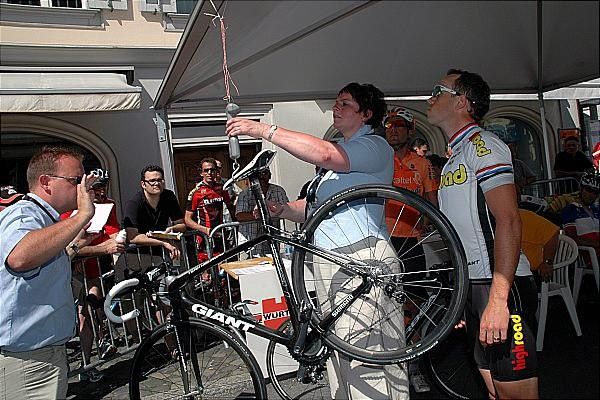 Kim Kirchen gets his bike weighed in before the start.