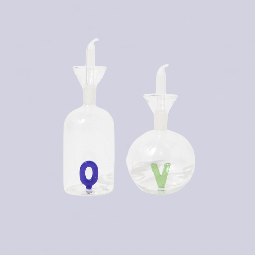 Glass oil and vinegar bottle with letters inside