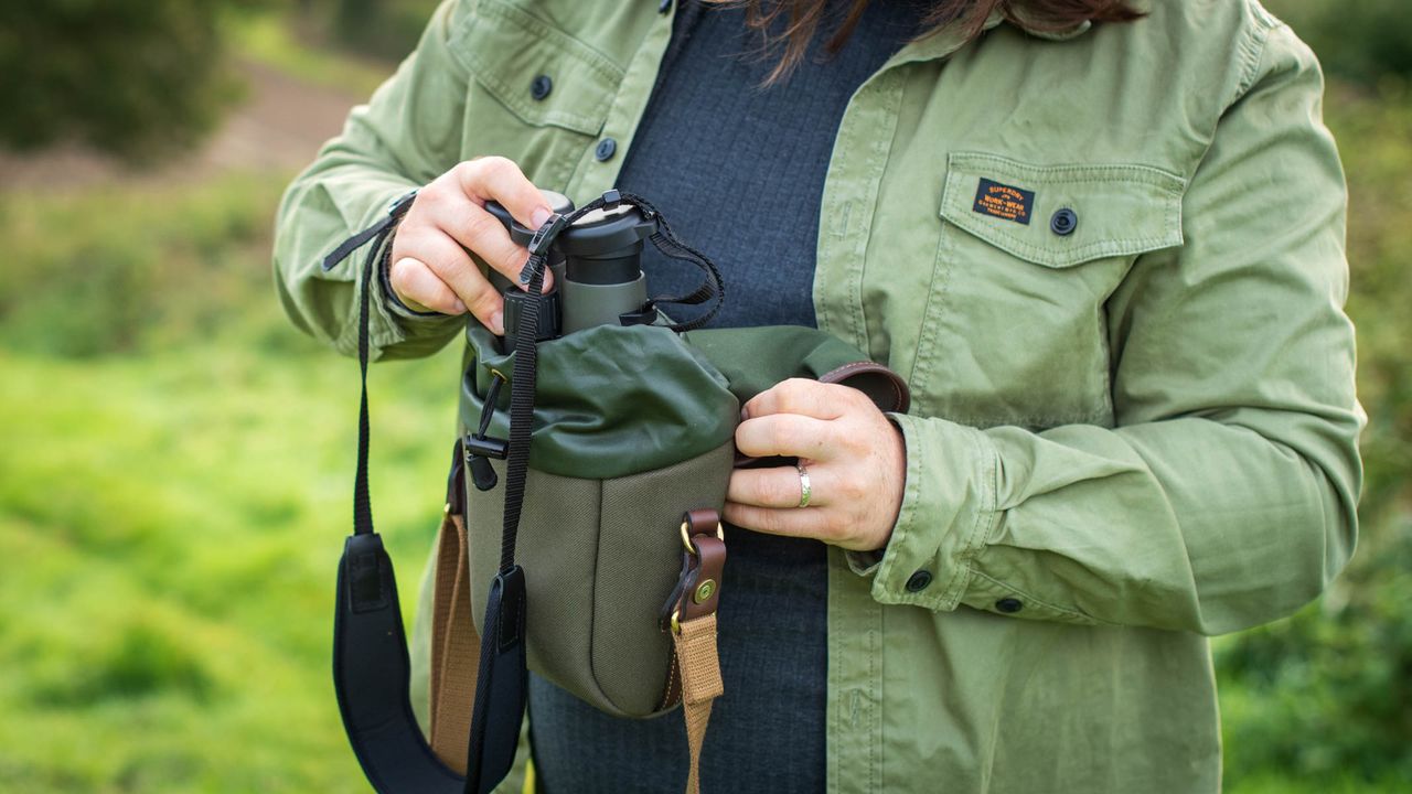 Leica Noctivid 10x42 being placed in Billingham bag