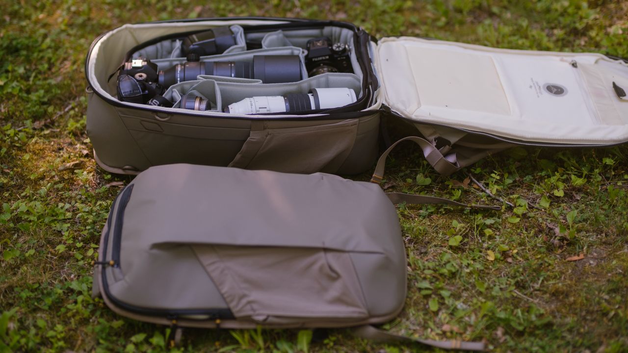 The Peak Design Travel 2-in-1 Backpack outdoors used by a photographer