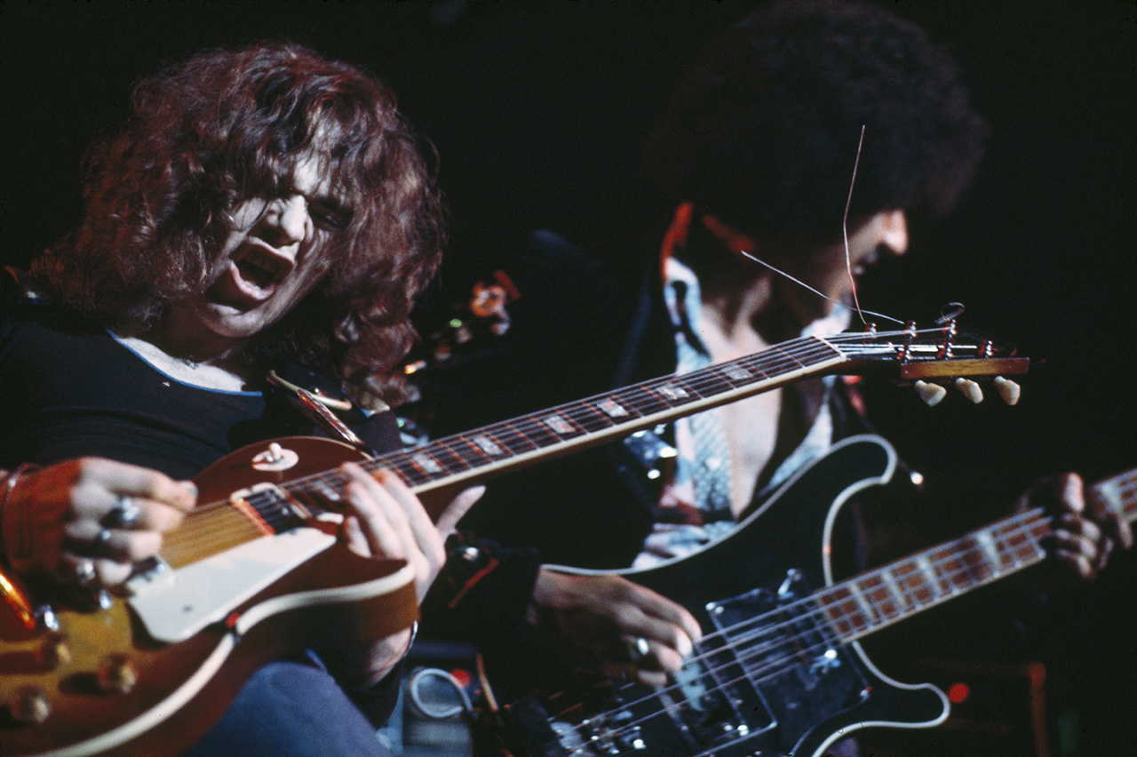 Brian Robertson (left) and Phil Lynott of Thin Lizzy perform on stage in Leeds, United Kingdom in December 1976