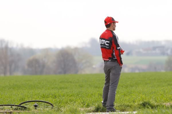 A lone member of the BMC staff waits for the bunch to pass through at the feed