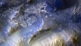This view of a region called Syrtis Major is from the 100,000th image captured by NASA&rsquo;s Mars Reconnaissance Orbiter using its HiRISE camera. The image was snapped on Oct. 7, 2025. Over nearly 20 years, HiRISE has helped scientists understand how the Red Planet&rsquo;s surface is constantly changing.