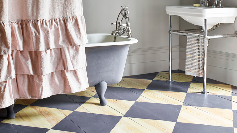 Clawfoot bathtub with grey wood checkerboard floor