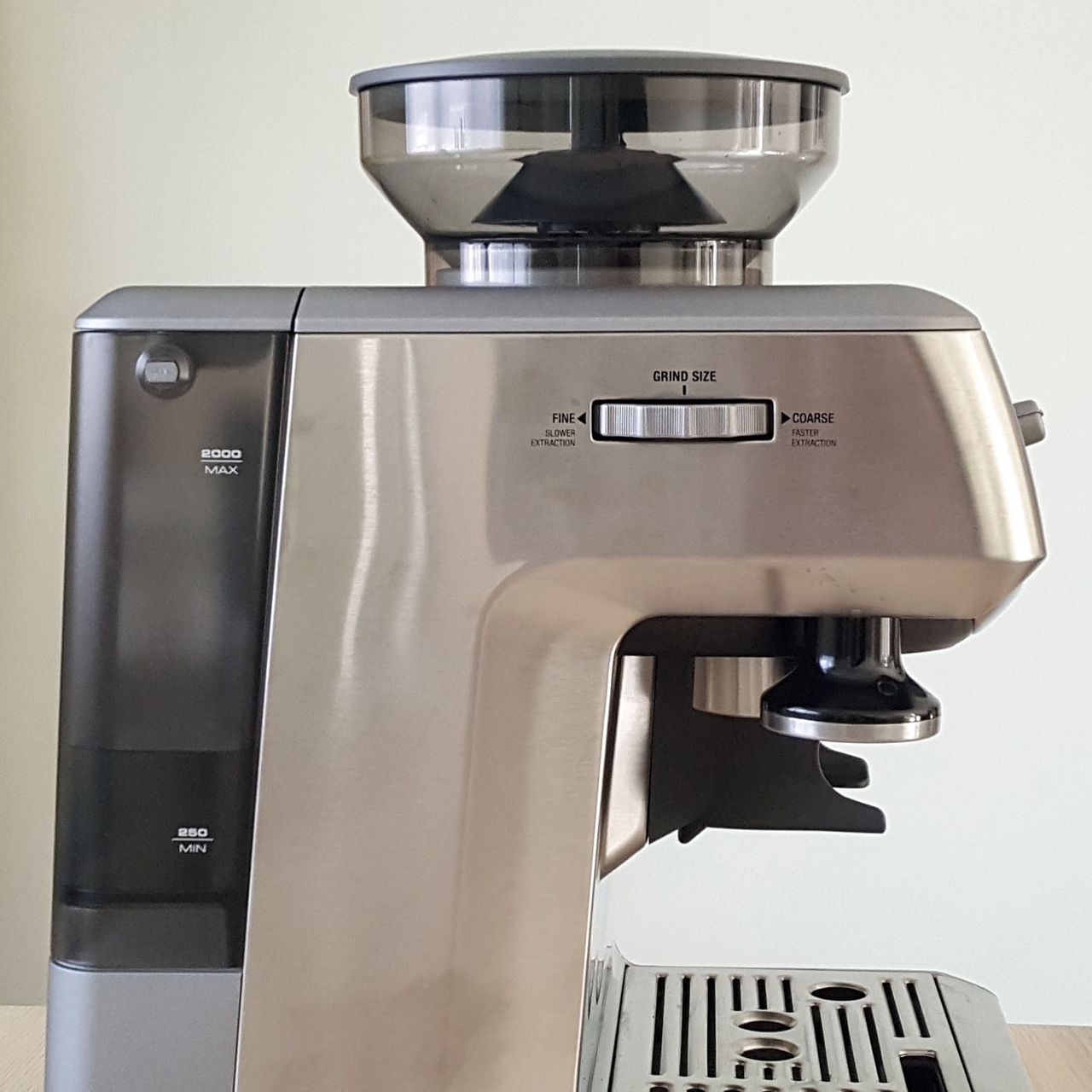Sage The Barista Express BES875UK Espresso Coffee Machine on a wooden table