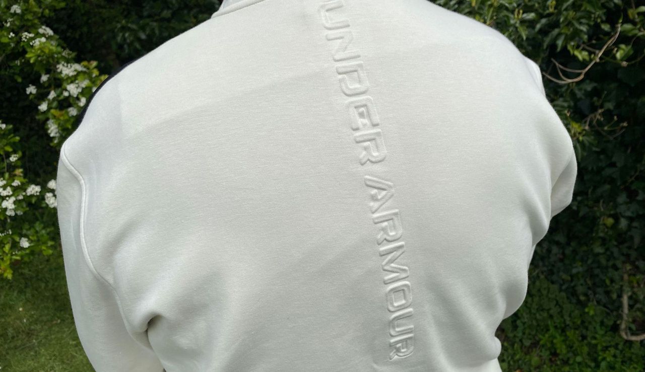 An Under Armour logo on the back of the Under Armour Tour Tips Full-Zip Bomber Jacket