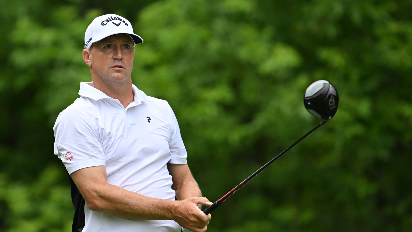 Alex Noren hits a driver and watches the tee shot