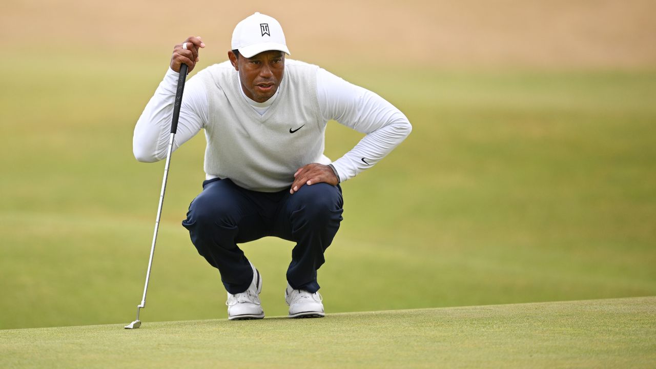 Tiger Woods lines up a putt at the 2022 Open at St Andrews