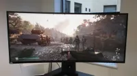 Alienware AW3418DW from the front on a back desk next to a window
