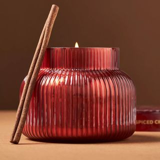 Spiced apple candle in a ribbed red glass jar