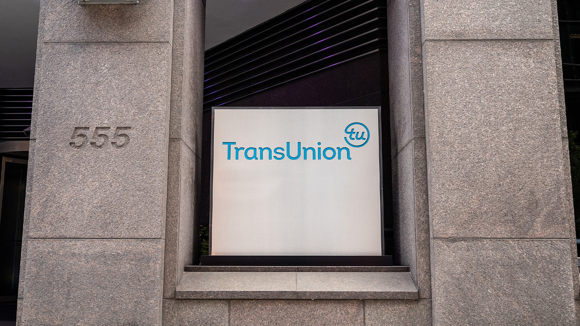 TransUnion logo pictured on a sign outside the company headquarters in Chicago, Illinois, USA.