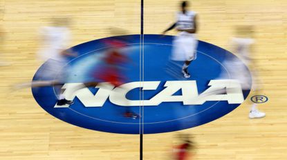 JACKSONVILLE, FL - MARCH 19: Mississippi Rebels and Xavier Musketeers players run by the logo at mid-court during the second round of the 2015 NCAA Men's Basketball Tournament at Jacksonville Veterans Memorial Arena on March 19, 2015 in Jacksonville, Florida. (Photo by Mike Ehrmann/Getty Images)