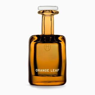 Lyn Harris Perfumer H orange leaf fragrance in orange glass bottle