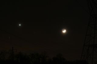 The crescent moon of Dec. 26, 2011 is partially illuminated by light reflected from Earth (Earthshine) in this view during its conjunction with Venus as seen by skywatcher Pat Curry on Dec. 26, 2011 from Chester County, Pa.