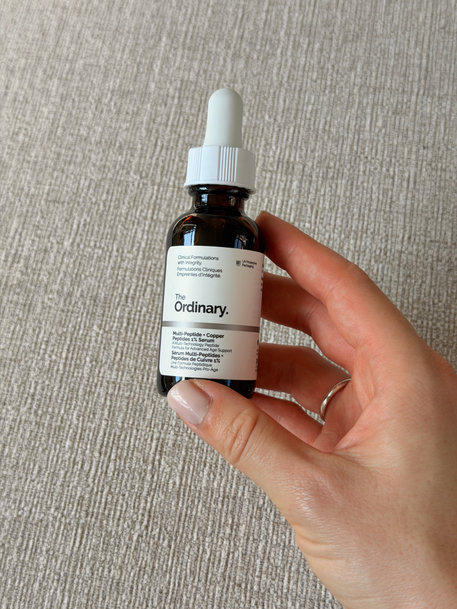 Grace holding The Ordinary Multi Peptide Copper Peptide 1% Serum