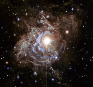 A Hubble Space Telescope image shows RS Puppis, one of the cepheids used to measure the expansion of the universe.
