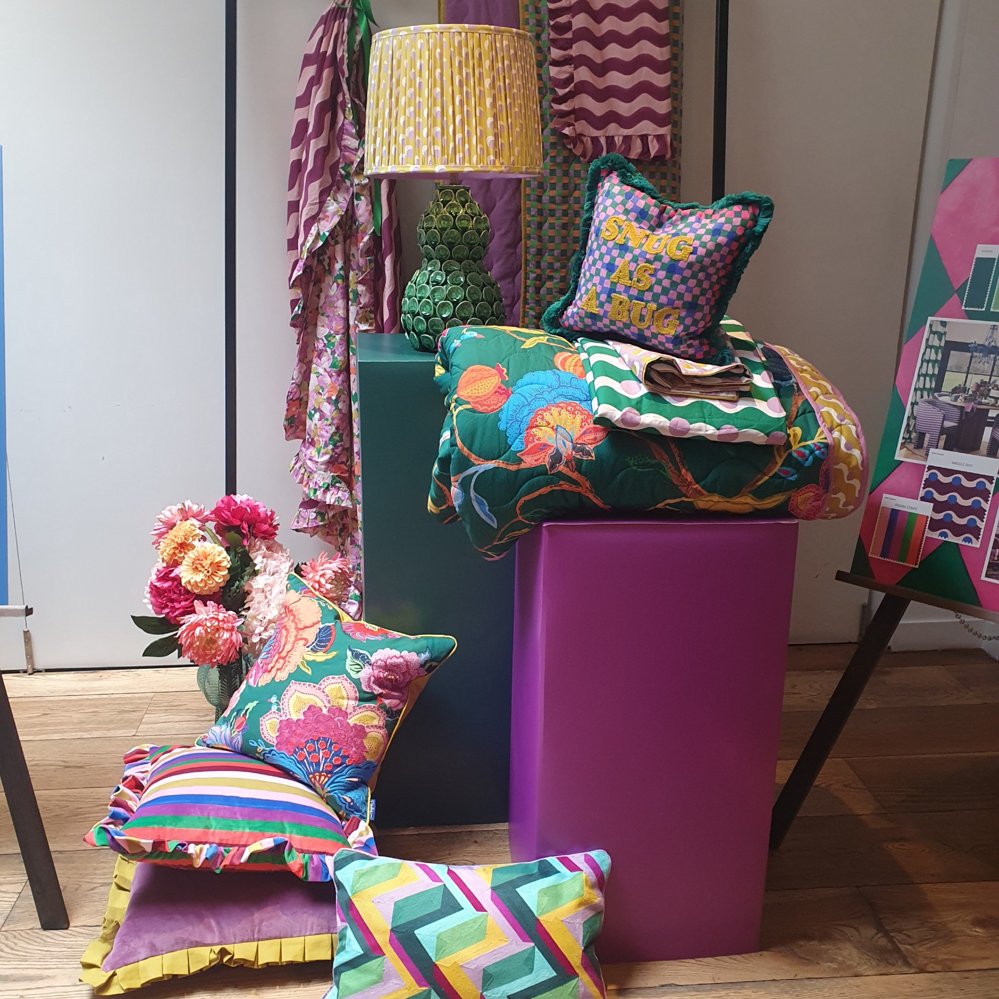 A ceramic table lamp, cushions and bedding from the Dunelm x Sophie Robinson collection at a press preview