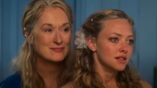 Meryl Streep and Amanda Seyfried stand together teary eyed in Mamma Mia!