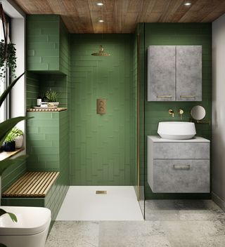 green tiled bathroom with walk in shower and gold fittings