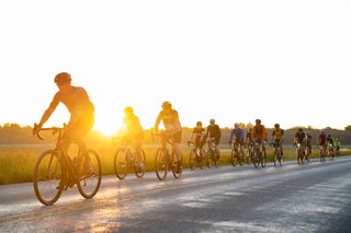 Riders return to Emporia in the morning light - Unbound gravel bike race