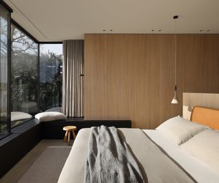minimalist neutral bedroo, with wooden wardrobes