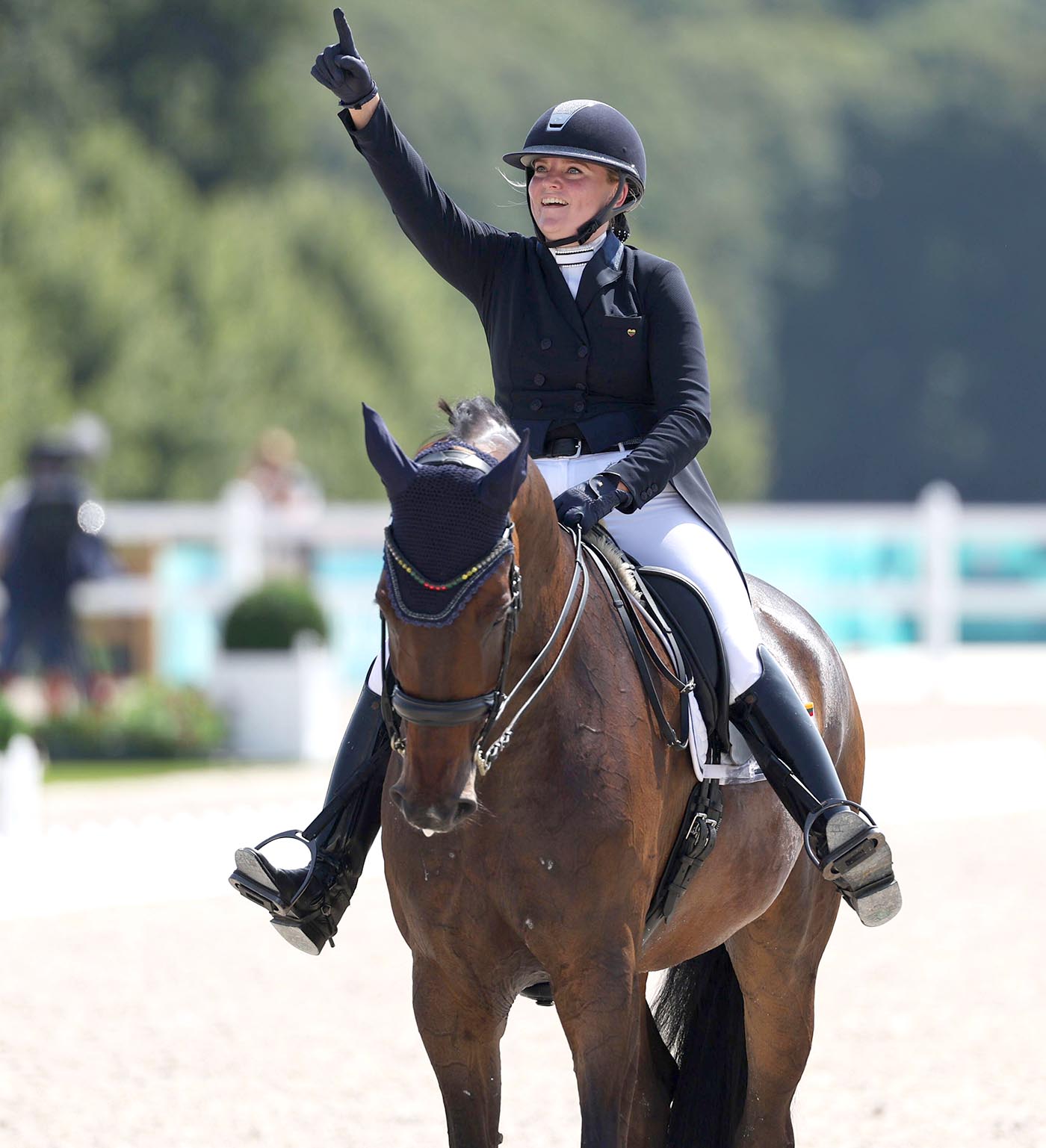Justina Vanagaite salutes the crowd after riding her grand prix on Nabab at Paris 2024.