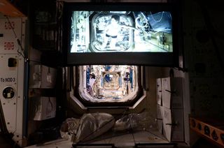 The Expedition 43 crew uses the new ISS Viewscreen to watch the movie "Gravity" on Saturday, April 25, 2015.