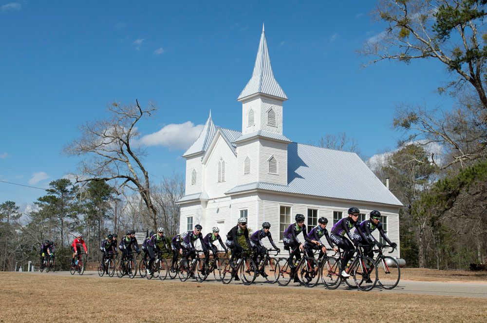 The Lupus Racing team pass the beautiful Whitesville Methodist Church on a ride.