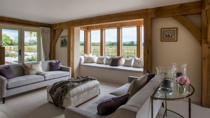 living room with white flooring and cushions