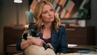 Becki Newton as Lorna Crane holding a dog in The Lincoln Lawyer season 3 episode 2