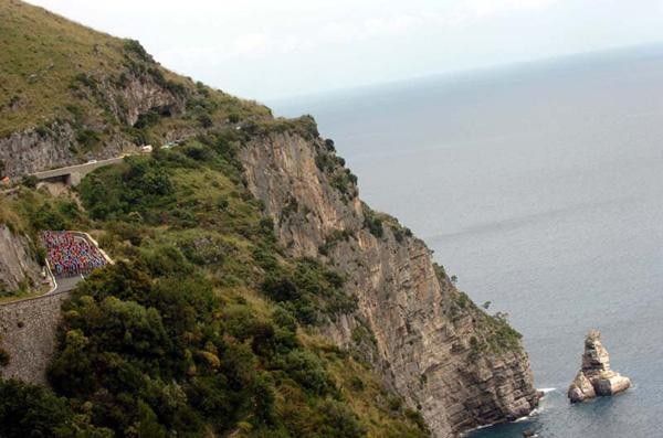 The peloton rides along slow to enjoy the view.