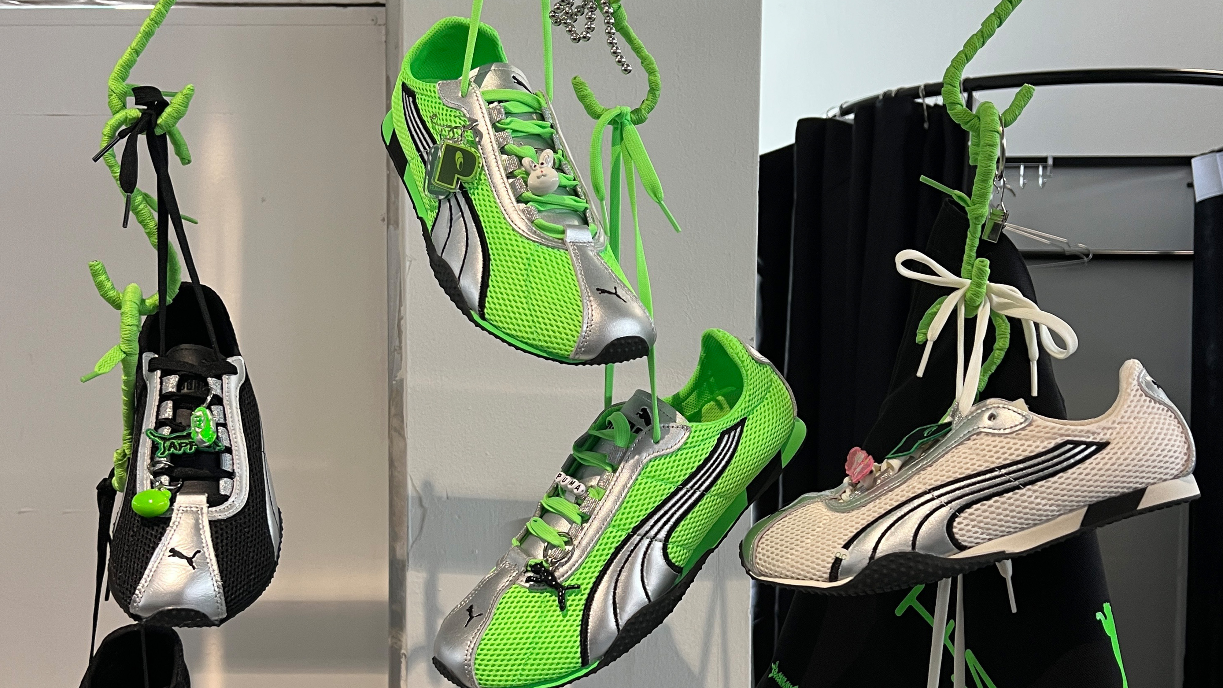 The first three colorways of Puma's new H-Street sneakers hanging at an activation for the shoe's launch in Seoul, South Korea.