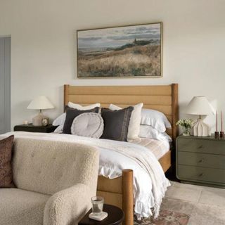 A light wooden bed in a neutral-toned bedroom