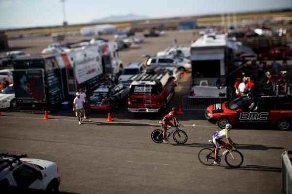 Riders roll around the team area before the start.
