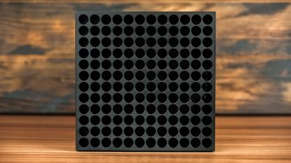 Xbox Series X seen from top on a wooden desk (expanded using generative AI)