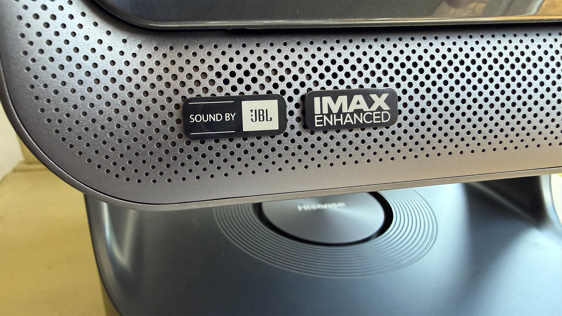Hisense C2 Ultra home cinema projector, close up on Sound by JBL logo on speaker grille