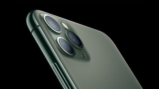 The back of an iPhone 11 Pro, showing its camera system.