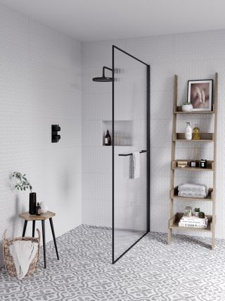 Wet room with single glass shower door patterned floor tiles and wooden ladder storage