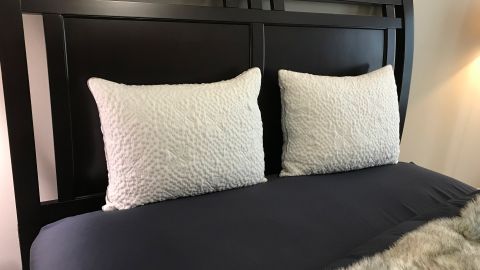 Two Sleep Number ComfortFit Pillows on a bed