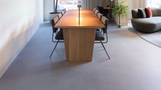 grey poured resin floor in dining room