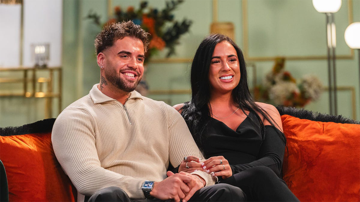 Nathan and Lacey looking happy on the couch at the final commitment ceremony