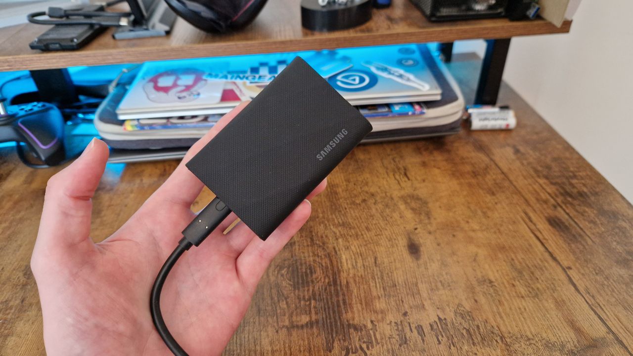 The Samsung T9 SSD in the hands of a reviewer