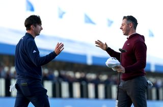 Rory McIlroy and Tom McKibbin greet each other at the 2024 Irish Open