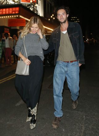 Sienna Miller and Oli Green seen in London in July 2023.