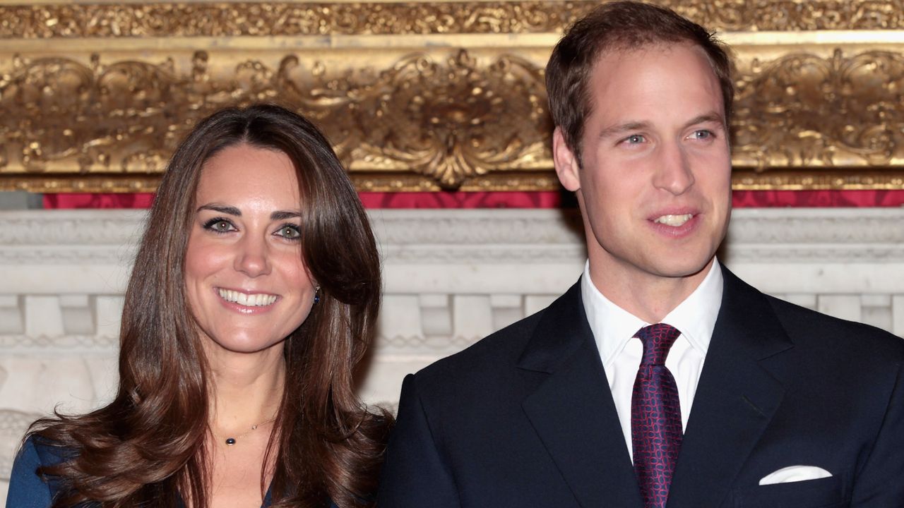 Kate Middleton&#039;s sapphire blue engagement dress seen as she and Prince William pose for photographs in the State Apartments of St James Palace