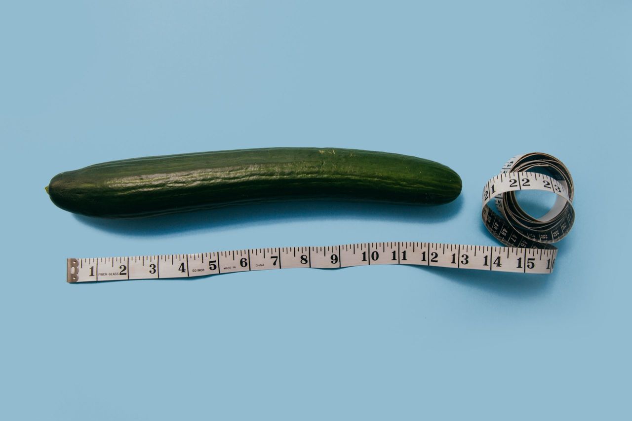 Perfect penis size: A cucumber next to a tape measure