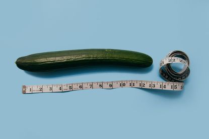 Perfect penis size: A cucumber next to a tape measure