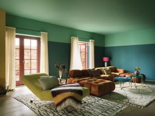 A living room with different paints on ceiling and walls