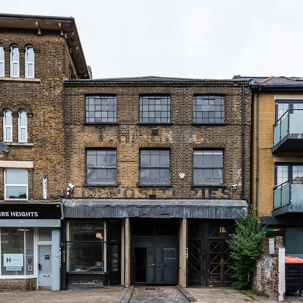 warehouse with bricked wall and black door