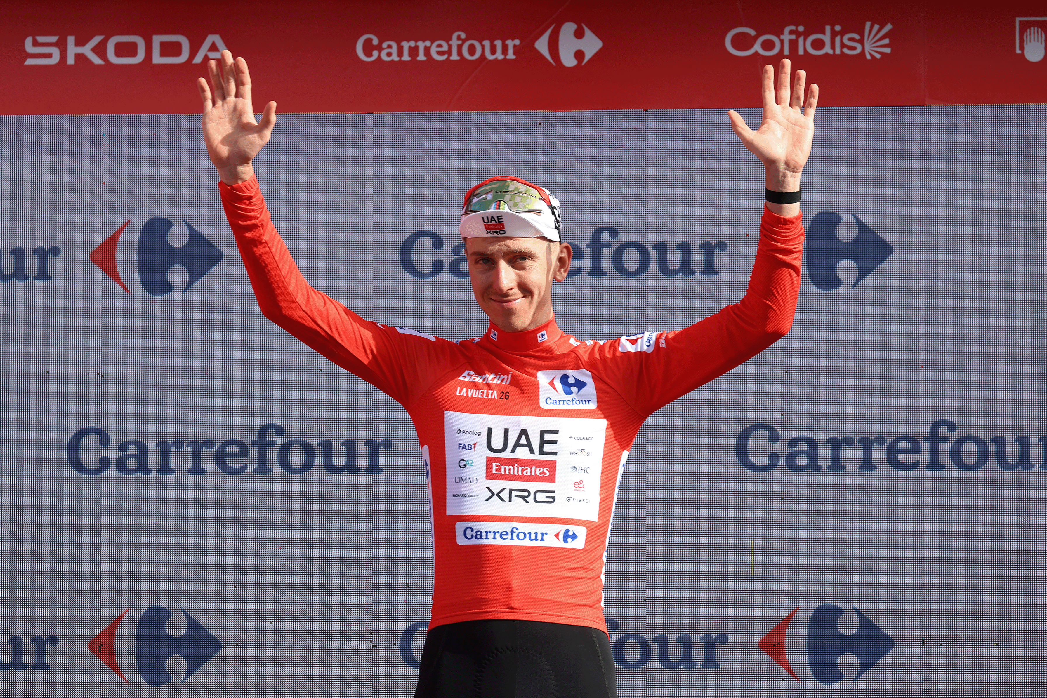 Tadej Pogacar of Slovenia and UAE Team Emirates XRG celebrates on the podium as the Red Jersey leader during the 2026 Vuelta a Espa&ntilde;a (Photo by Alexander Hassenstein/Getty images)